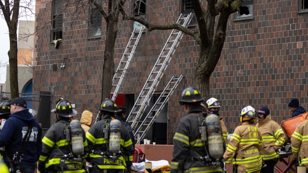 A New York apartment fire has killed 19 people, including 9 children