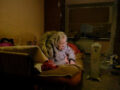 Unable to walk, Galyna Rasstanna, 86, lies in her bed and weeps and begs for the shelling to stop.
