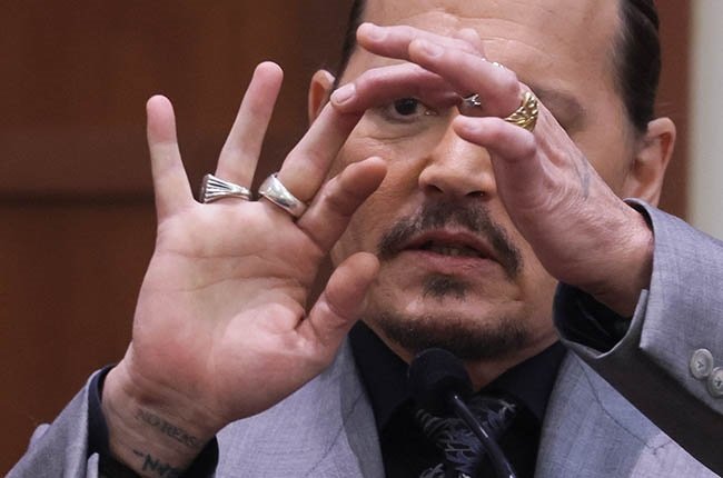 Johnny Depp displays the middle finger of his hand, injured while he and his ex-wife Amber Heard were in Australia in 2015.