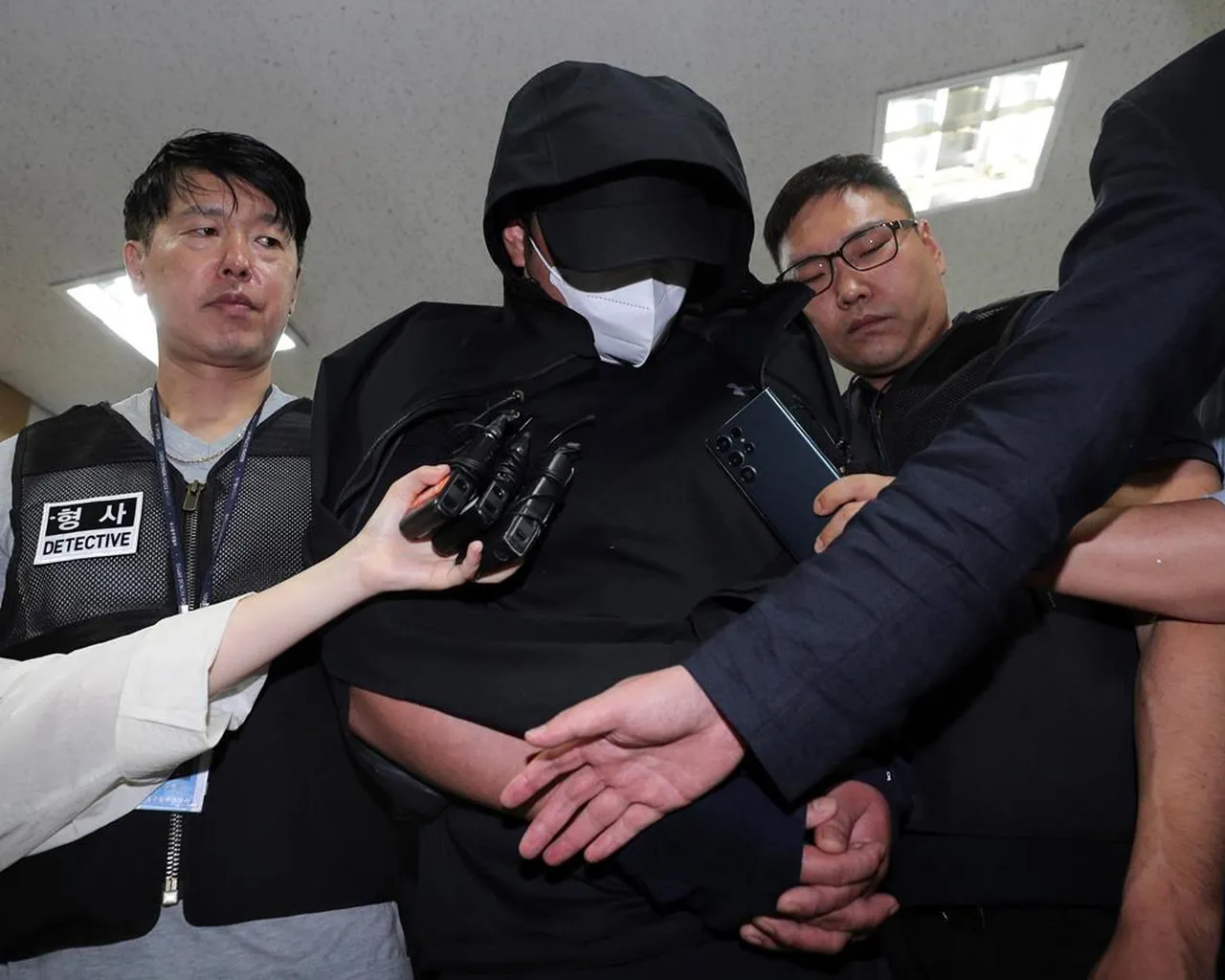 South Korean Arrested For Opening Plane Emergency Exit Door Faces Up